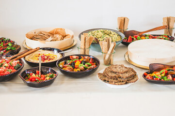Healthy vegetarian food with hummus and salads