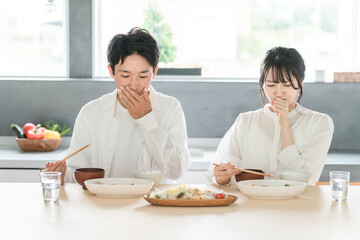 Married couples eating at home (cooking at home, dissatisfaction, bad taste, emotional abuse, marital quarrel, anger)

