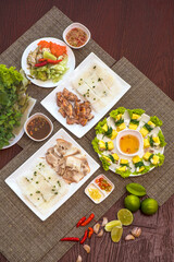 Vietnamese Traditional Platter with Grilled Pork, Boiled Pork, Fresh Vegetables, and Dipping Sauce