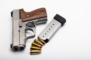 Gun , Semi auto pocket hand gun with bullet magazine on white background