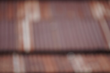 Close-up of a weathered brick wall with various shades of brown and red.