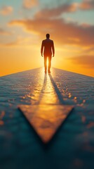 Man walking towards a bright sunset on a path shaped like an arrow symbolizing hope direction and a new beginning