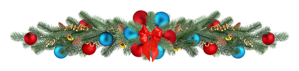 Christmas tree branches with festive ornaments isolated on white