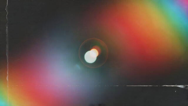 Abstract vintage light leak overlay featuring vibrant rainbow colors, central lens flare, and distressed film grain texture. - Powered by Adobe