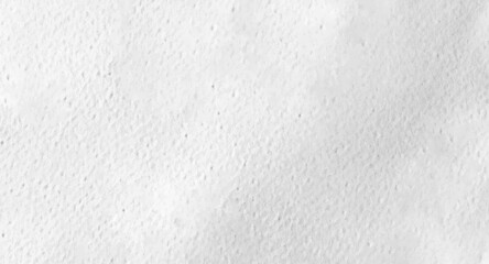 The white paper surface with its clear texture reveals subtle shadows and delicate texture patterns.