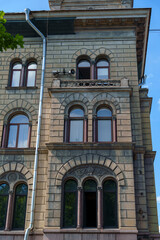 Image Title & Keywords for Stock Photography сказал: Title: Historic stone building with arched windows on sunny day in European city