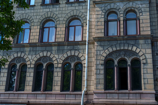 Image Title & Keywords for Stock Photography сказал: Title: Historic stone building with arched windows on sunny day in European city