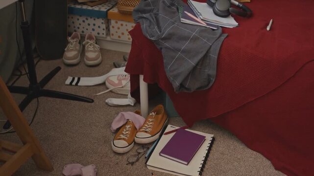 Messy Teen Room Filled with Sneakers and School Stuff