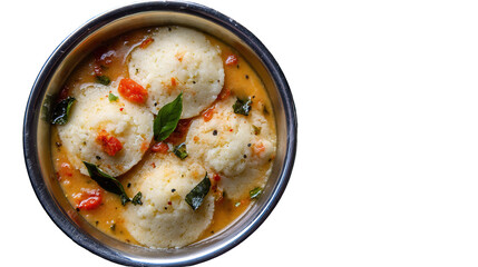The image shows a bowl of idli sambar, a popular South Indian dish. The bowl contains several soft, round steamed rice cakes (idlis) served in a flavorful lentil-based vegetable stew (sambar). The sam