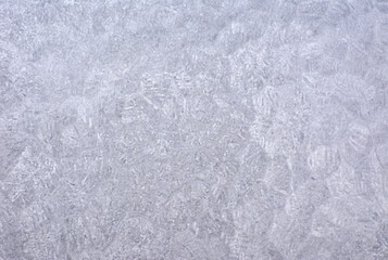 A close-up of a roughly finished gray marble surface with characteristic processing marks.