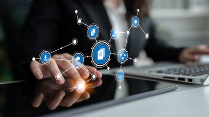 A business professional interacts with a digital interface that illustrates various data management features, showcasing modern workplace innovation and technology. Tessel