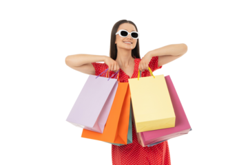 Young woman enjoys shopping with colorful bags in hand, on white, PNG
