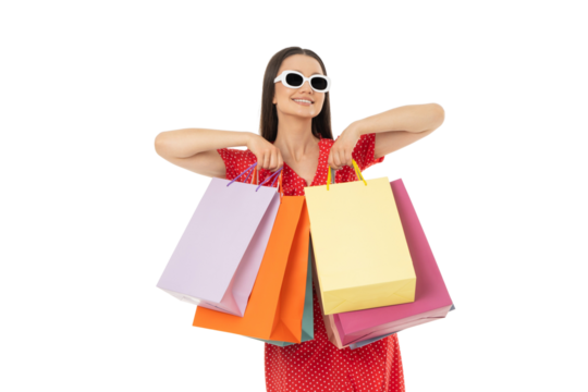 Young woman enjoys shopping with colorful bags in hand, on white, PNG