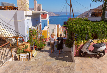 Stone alley with sea view in Symi, Symi, Greece