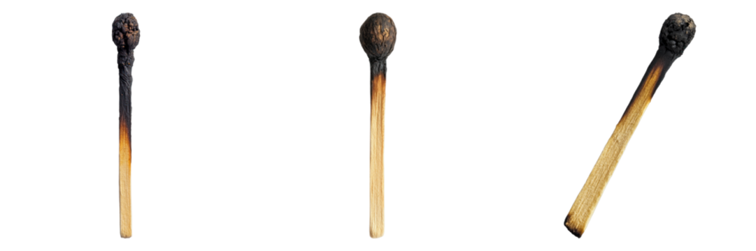 A close-up shot of three burnt matchsticks showing different stages of burning. The charred remains and smoky tips evoke a sense of finality