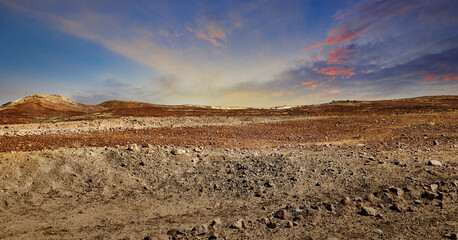 Scenic desert landscape with cloudy sunset sky