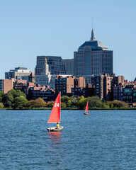 People are surfing in Charles river under a sunny day	