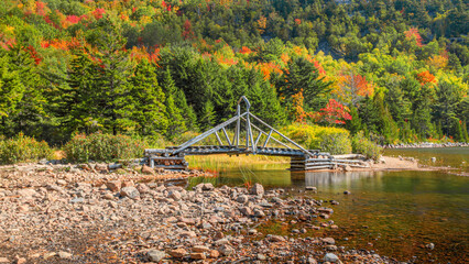 Autumn scenes at Jordan Pond with a bridge at foreground	