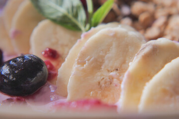 Delicious breakfast bowl with banana and berries