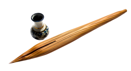 Traditional wooden calligraphy pen and small decorative ceramic inkwell isolated on white background