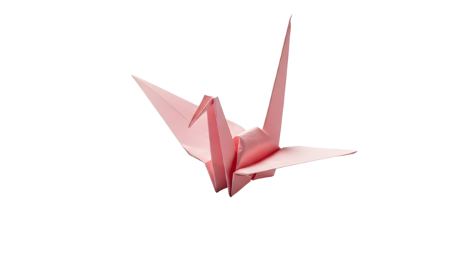 Pink traditional Japanese origami crane isolated on white background as a symbol of peace