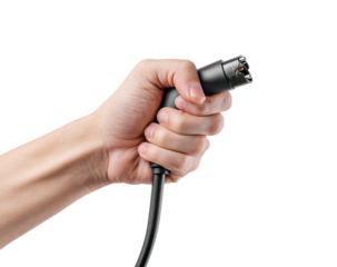 Hand holding a black charging cable connector, black background