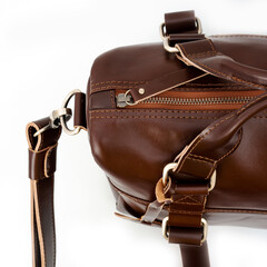 Detail of a beautiful brown leather bag for women on a white background