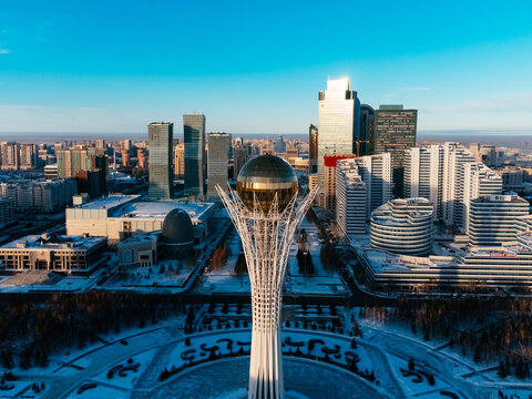 Aerial drone view Nur-Sultan, Kazakhstan Qazaqstan city center with skyscrapers and Baiterek Tower.