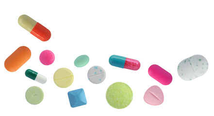 horizontal composition of numerous brightly colored pharmaceutical pills, tablets, and capsules scattered across a solid transparent background.