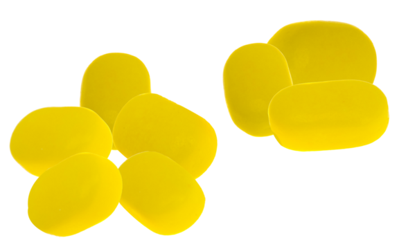 close-up photograph of eight irregularly shaped, uncoated yellow tablets, possibly representing natural herbal supplements or dietary aids, grouped together on black.