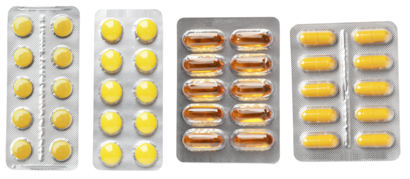 four assorted pharmaceutical blister packs arranged neatly side-by-side, showcasing round tablets and oblong capsules against a solid black backdrop.