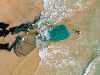 Aerial view of Vietnamese fishermen casting nets in Da nang