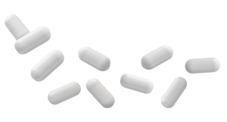 dramatic close-up photograph featuring nine individual white, bar-shaped pharmaceutical tablets scattered loosely and isolated against a stark transparent background.