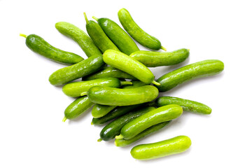 Fresh mini baby cucumbers on white background
