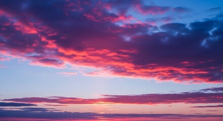 Dramatic colorful sunset sky with vibrant pink and purple clouds.