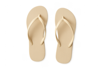 Pair of beige flip-flops ready for summer beach