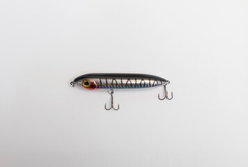 Metal fishing lure on white background