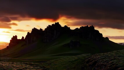 Mountain silhouette illuminated by sunset, dramatic sky background for landscape, travel, or nature imagery