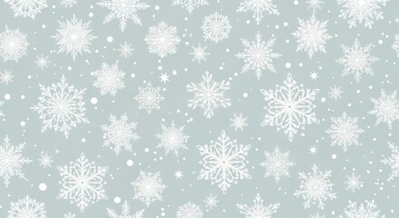 Delicate white snowflakes in various sizes on soft blue grey background creating a wintery texture with soft lighting and a repeating pattern for festive design elements