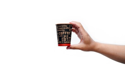 Isolated hand holding paper coffee cup with black lid. Enjoying takeaway coffee with stylish cup