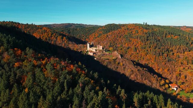 Aerial shot around Rochebaron Medieval Castle near Bas en Basset in Haute Loire departement during fall season, Auvergne Rhone Alpes region, France