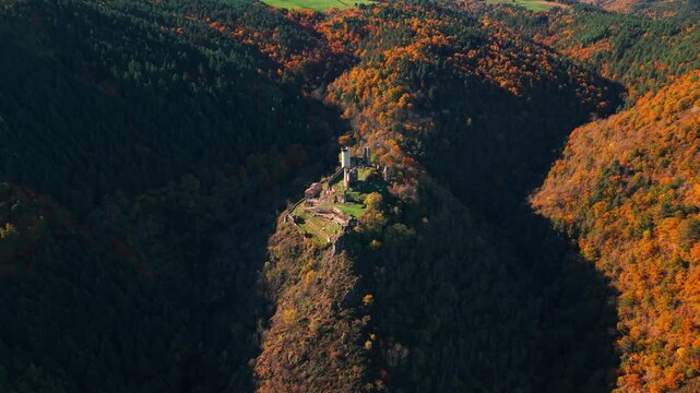 Aerial shot arround the Rochebaron Castle near Bas en Basset during fall season in Haute Loire departement, Auvergne Rhone Alpes region, France