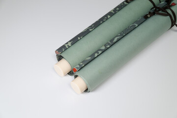 Close-up of Light Green Japanese Hanging Scroll on White Background