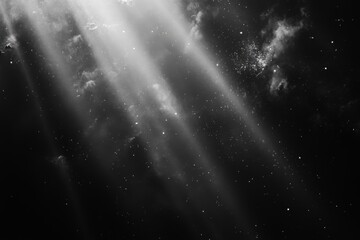 Sun rays shining through clouds creating dramatic light beams