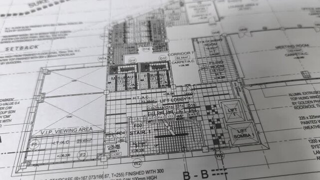 Close-up view of an A1 construction drawing. This large-format blueprint on white paper contains crucial technical details. It's used by site personnel for accurate building construction and execution