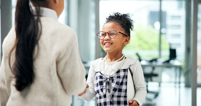 Business, children or handshake in office with smile for recruitment, CV document or work costume. Happy girl, kids or shaking hands in workplace with resume for job interview, role play and pretend.