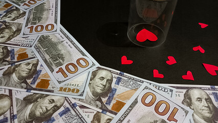 A symbolic image showing, dollar bills, and red heart shapes, representing the balance between love, money, and justice in relationships, divorce, or emotional decisions.