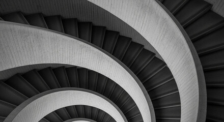 Fototapeta premium Abstract monochrome spiral staircase architecture with repeating patterns and geometric forms viewed from above