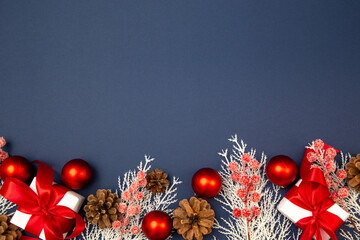 Merry Christmas and Happy New Year greeting card, frame, and banner. Holidays design. Noel and Feliz Navidad. Gifts and decorations, top view, flat lay. Text space, copy space winter background.