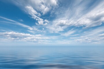 Fototapeta premium Gentle ocean waves under a sky with streaky white clouds